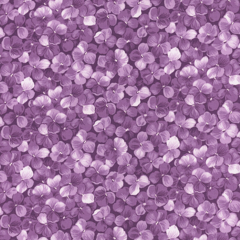 Fabric with a packed purple hydrangea flower motif.