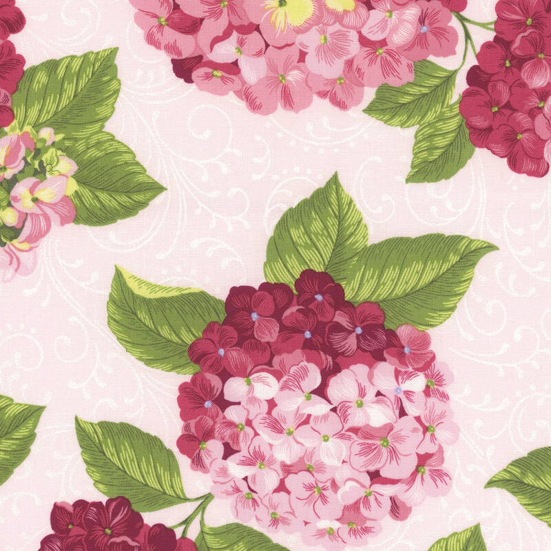 Cream fabric with large tossed pink hydrangeas with green leaves.