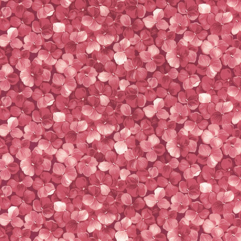 Fabric with a packed pink hydrangea flower motif.