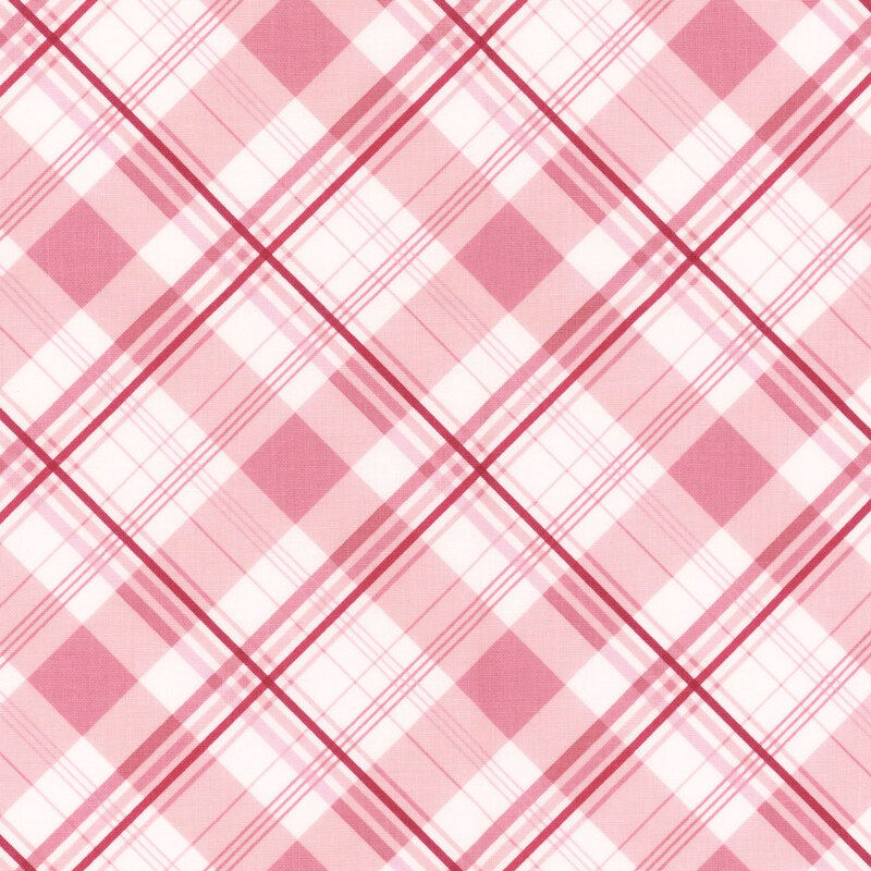 Red, pink, and white plaid fabric with intersecting lines of varying width.