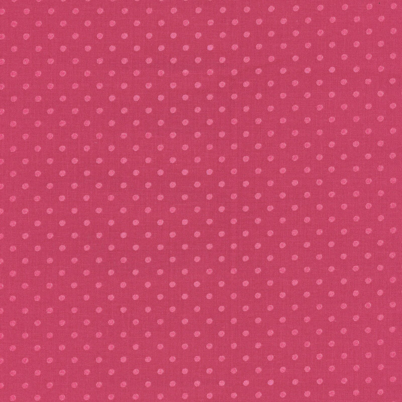 Raspberry pink fabric with tonal polka dots.
