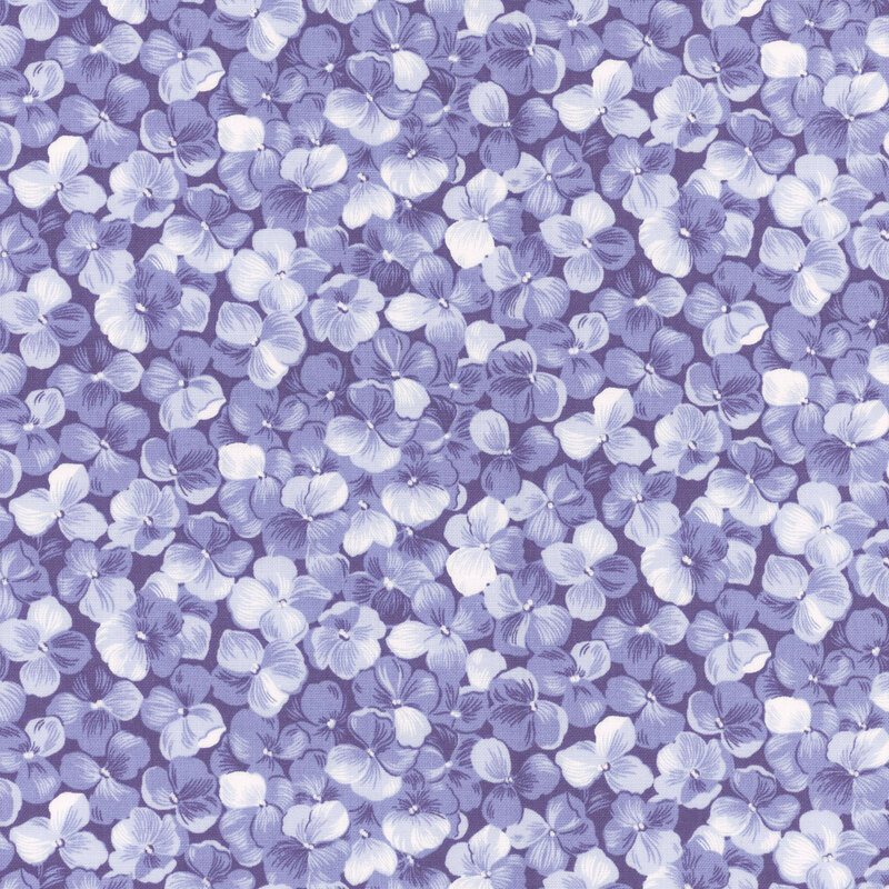 Fabric with a packed blue hydrangea flower motif.