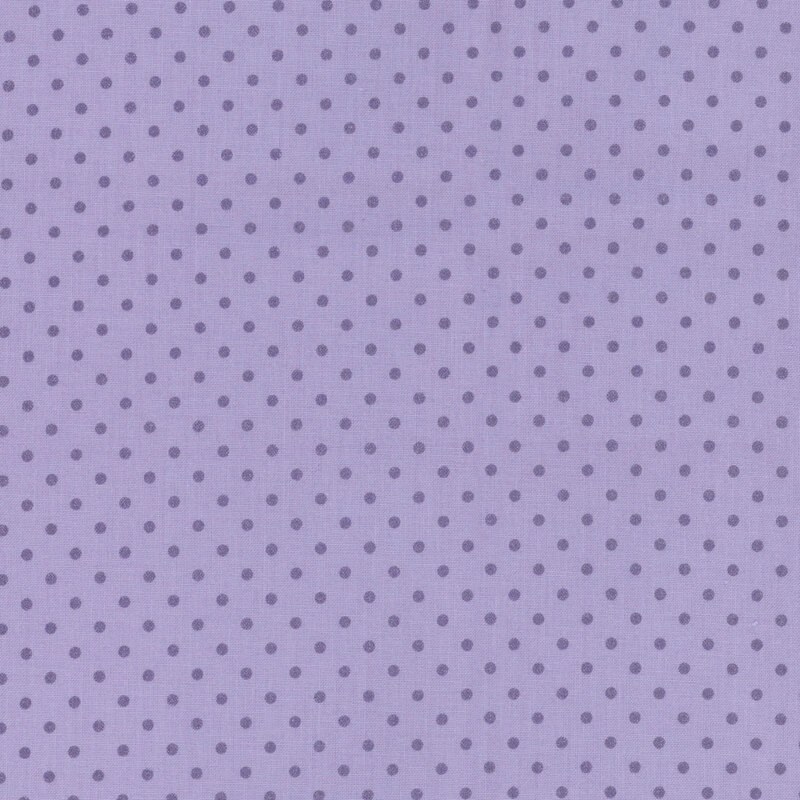 Dark periwinkle blue fabric with tonal polka dots.