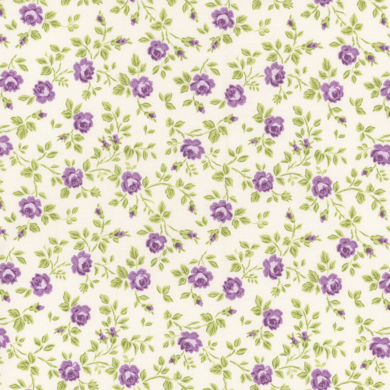 Cream fabric with tossed green leaves and purple buds.
