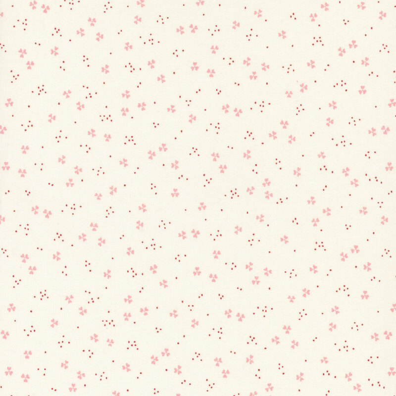A light cream fabric with scattered pink abstract patterns and small red dots.