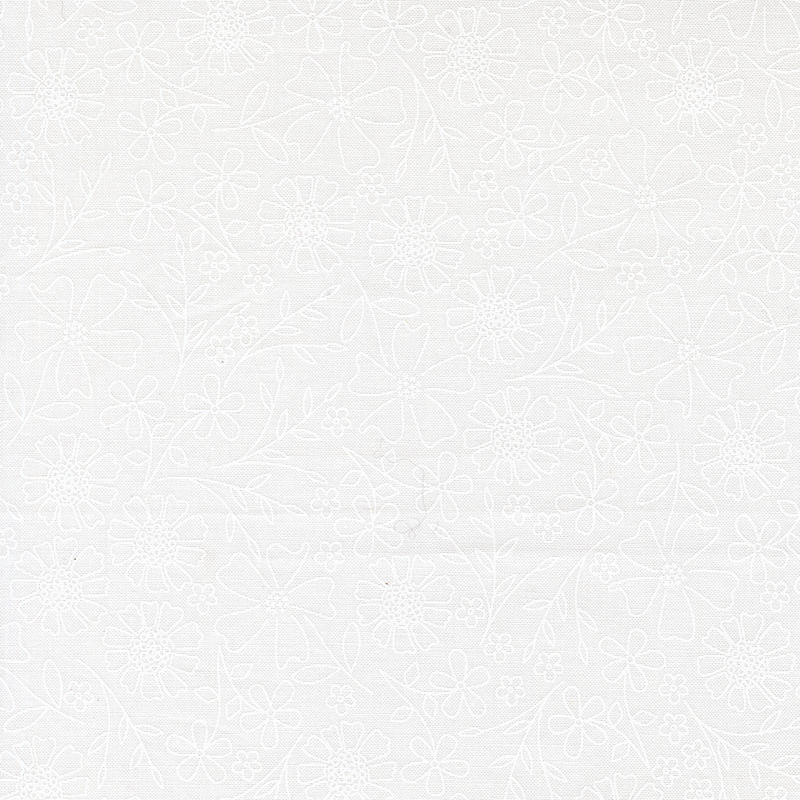 Tonal white on white fabric with outlined florals.