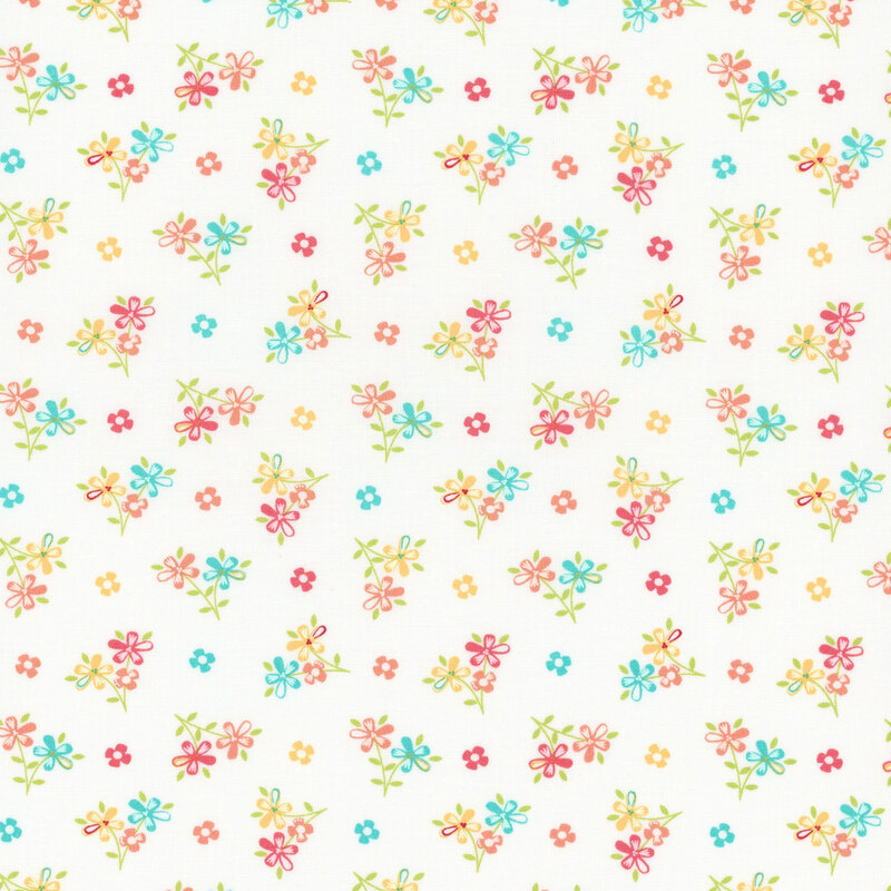 White fabric with scattered multicolor bouquets and flower blossoms. 