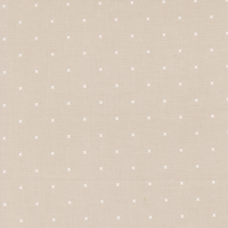 Light stone gray fabric with small x's that resemble cross stitching.