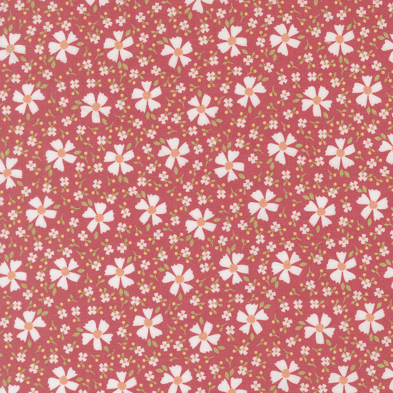 Strawberry red fabric with white florals and smaller blossoms scattered between.