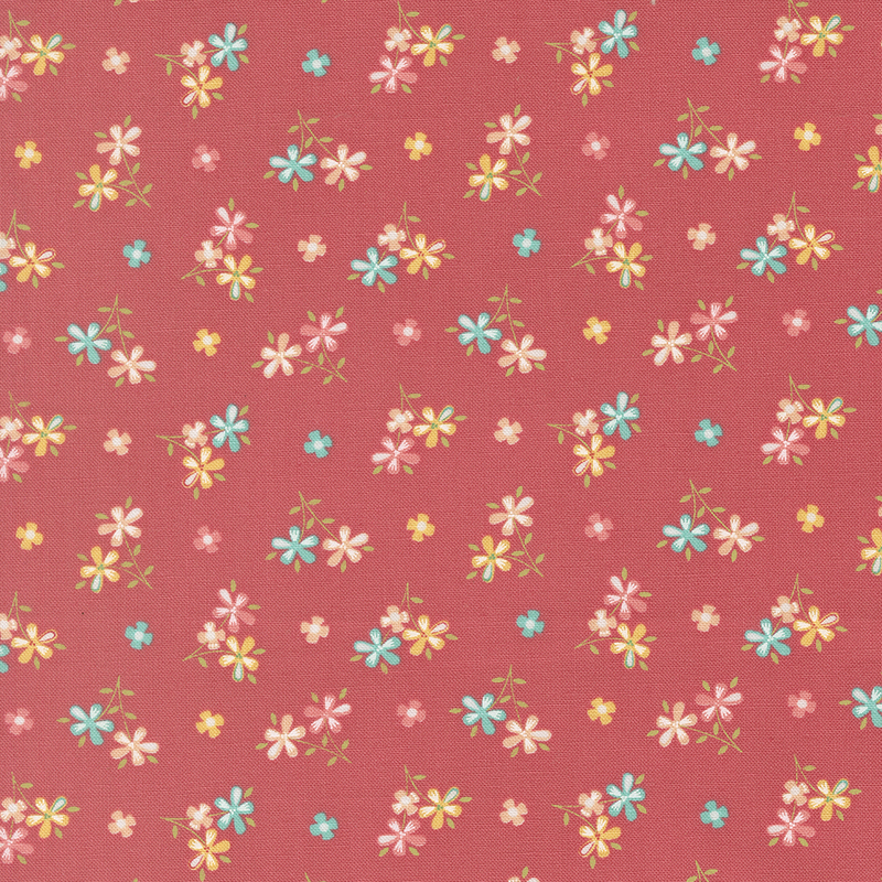 Strawberry red fabric with scattered multicolor bouquets and flower blossoms. 