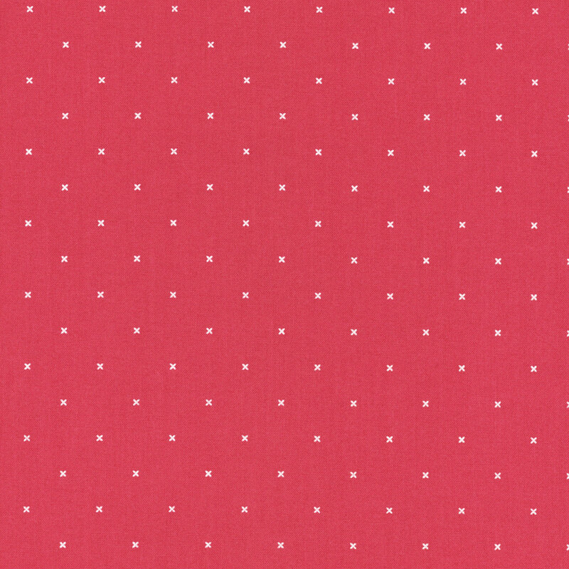 Strawberry red fabric with small x's that resemble cross stitching.