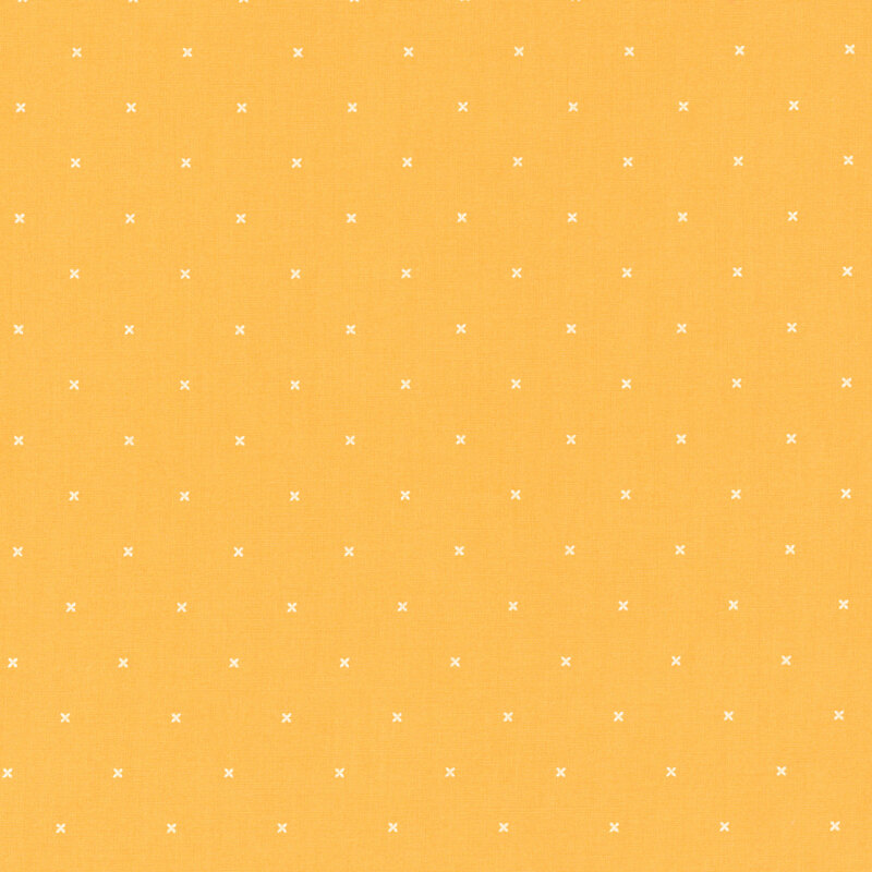 Bright yellow fabric with small x's that resemble cross stitching.