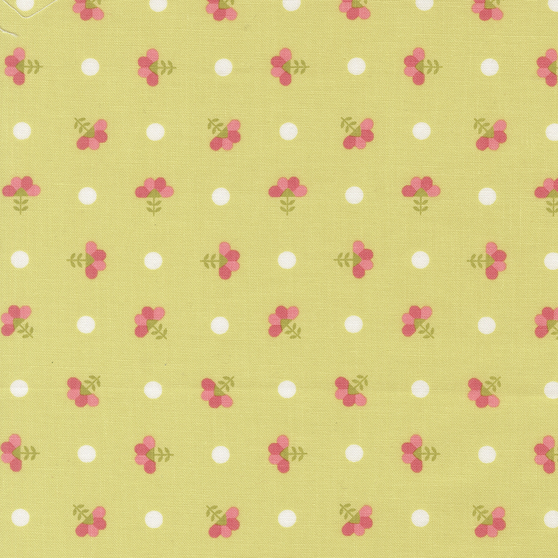 Lime green fabric with white polka dots and ditsy florals.