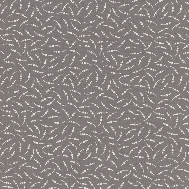 Slate gray fabric with abstract dots and lines scattered across the design.