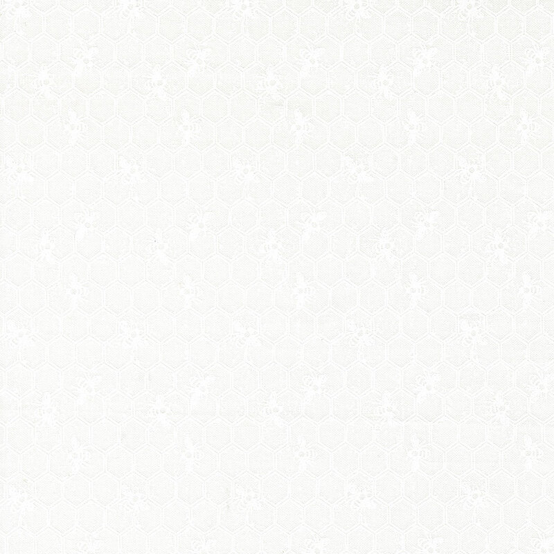 White on white fabric featuring a Honeycomb pattern with bees