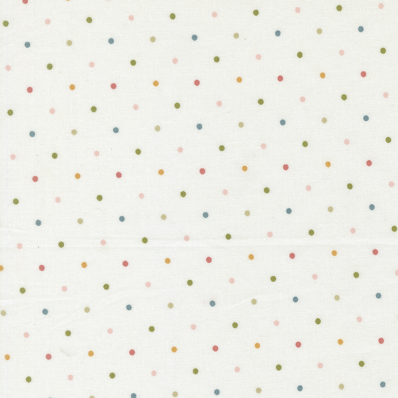 White fabric with a multicolored polka dot pattern.