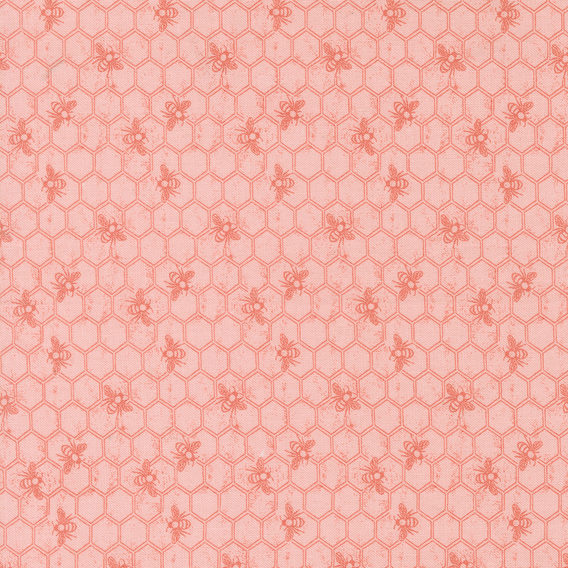 Tonal pink fabric featuring a Honeycomb pattern with bees