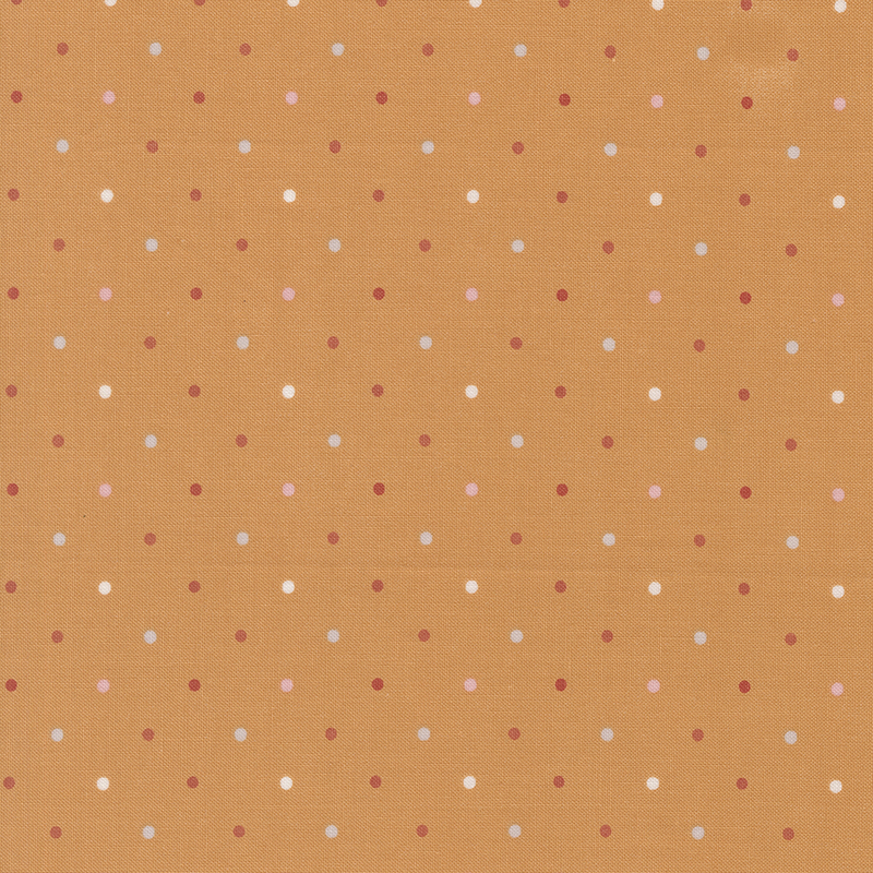Orange fabric with a white, pink, light gray and red polka dot pattern.