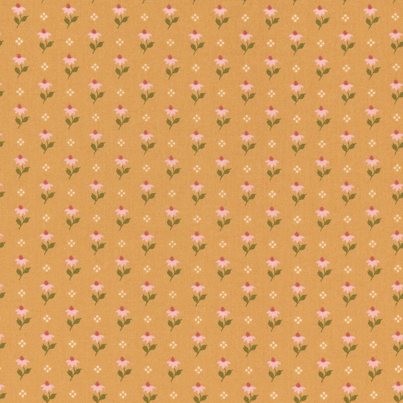 Golden yellow fabric featuring a pattern of pink flowers and white dots.