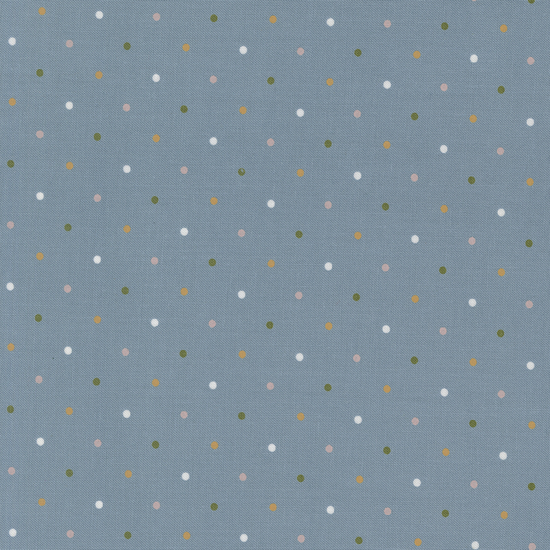 Blue fabric with a white, yellow, green and pink polka dot pattern.
