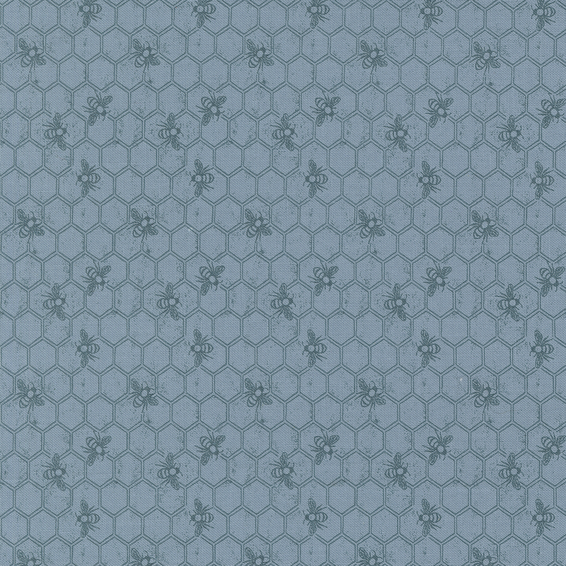 Tonal blue fabric featuring a Honeycomb pattern with bees