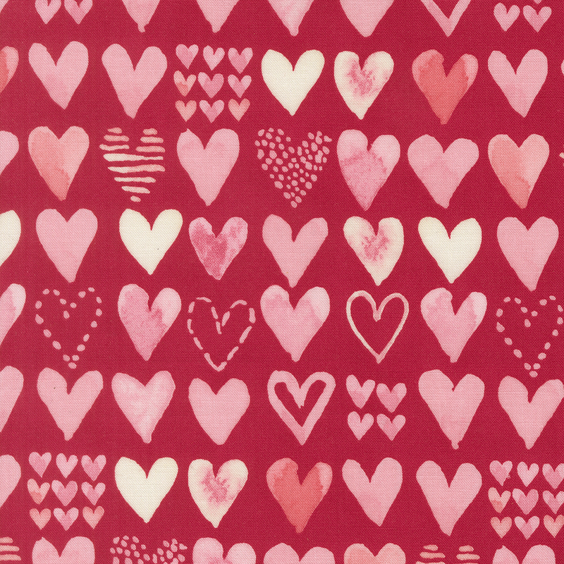 Cherry red fabric with rows of pink and cream watercolor hearts in varying designs.