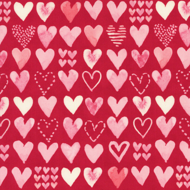 Cherry red fabric with rows of pink and cream watercolor hearts in varying designs.