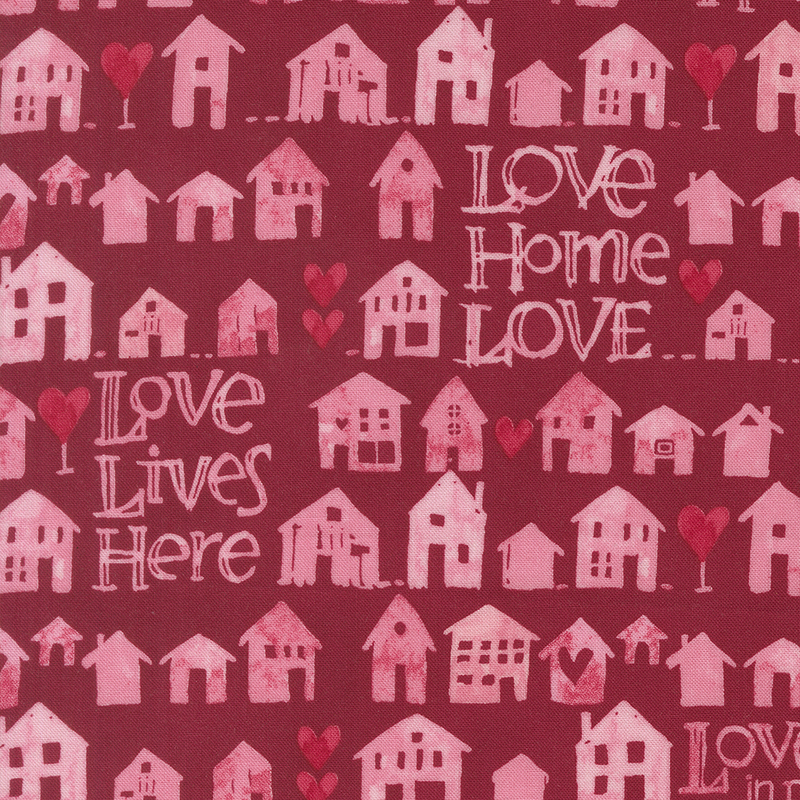 Cranberry red fabric with rows of pink watercolor houses and phrases like 