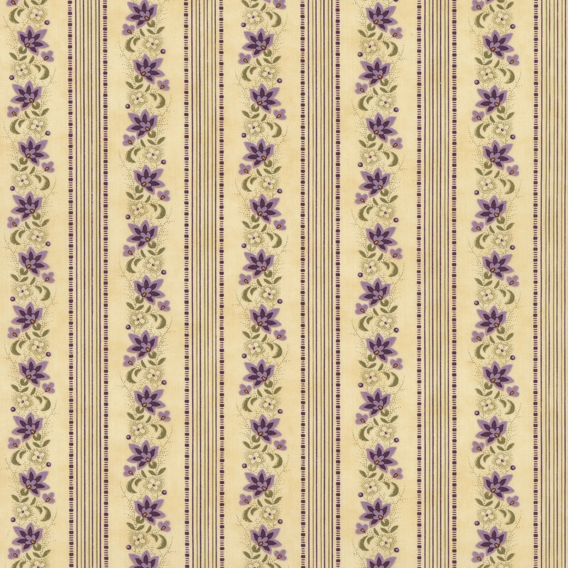 Light tan fabric with lines of thin purple and green stripes and violet flowers.