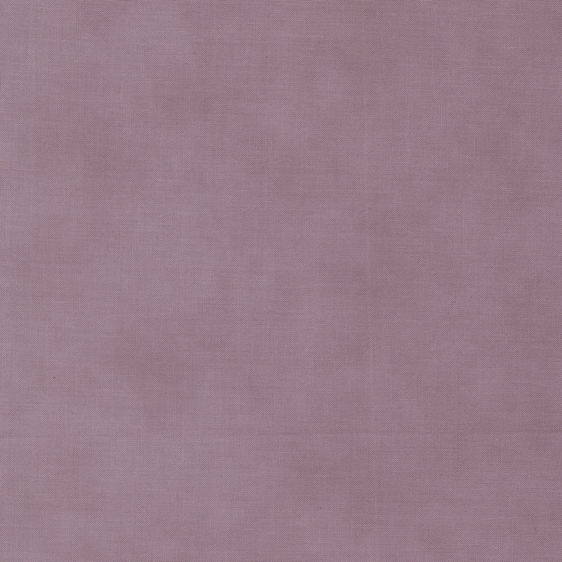 Solid mottled light purple fabric.