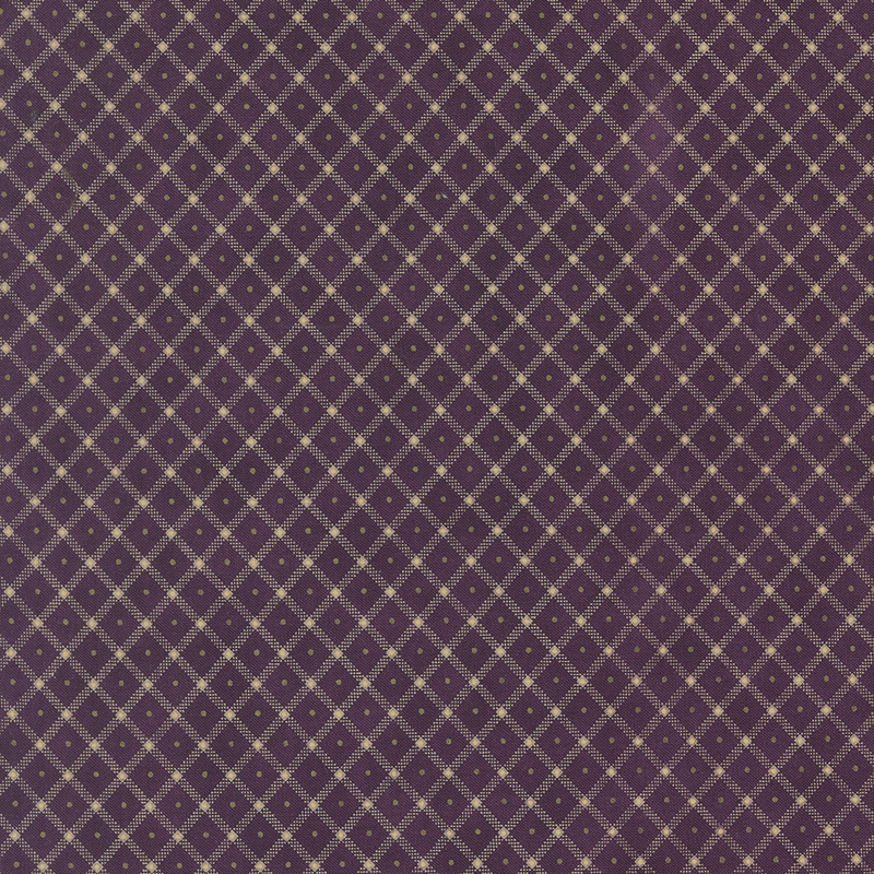 Plum purple fabric with a cream lattice design and green pinprick dots in the center of each.