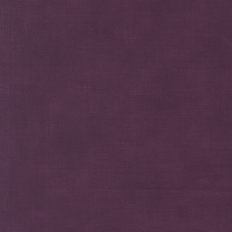 Solid mottled plum purple fabric.