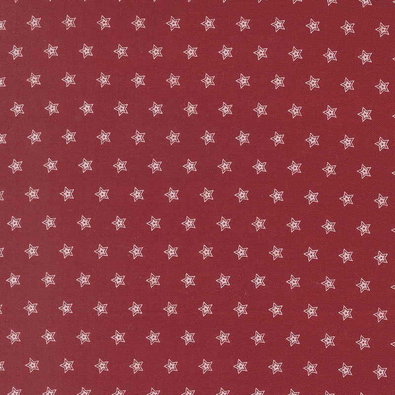 Red fabric featuring a repeating pattern of white outlined stars.
