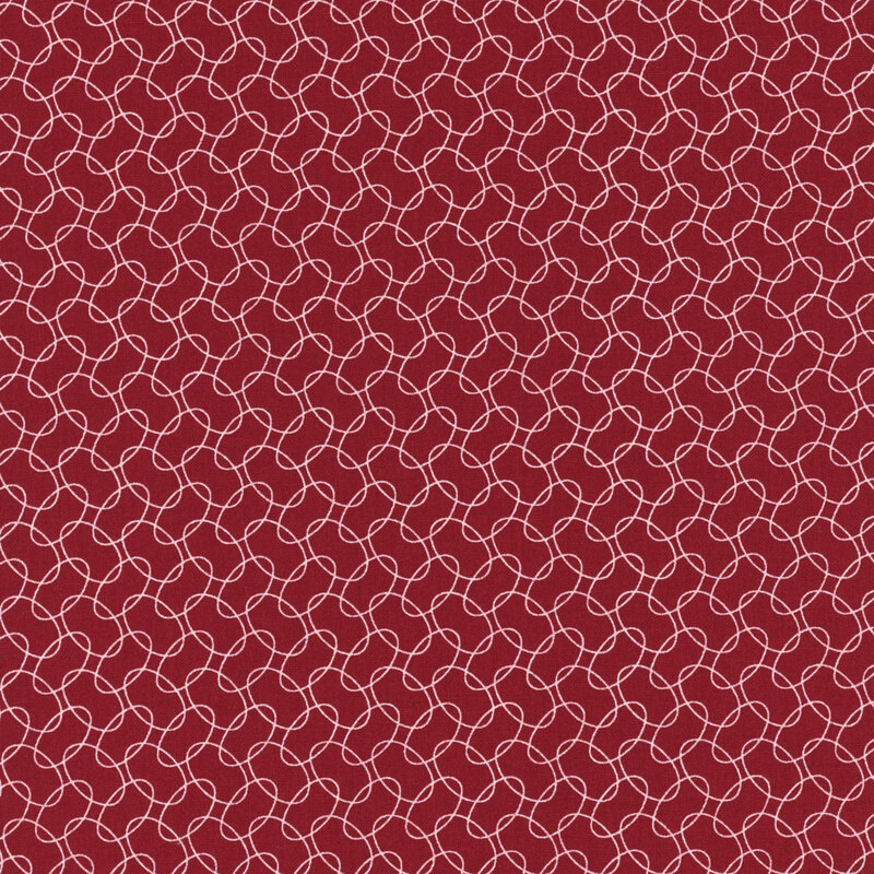Red patterned fabric featuring a white, interlocking loop design on a deep red background.