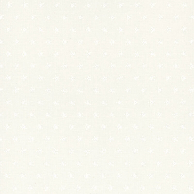 Light beige fabric with a subtle pattern of small, white stars evenly spaced throughout.