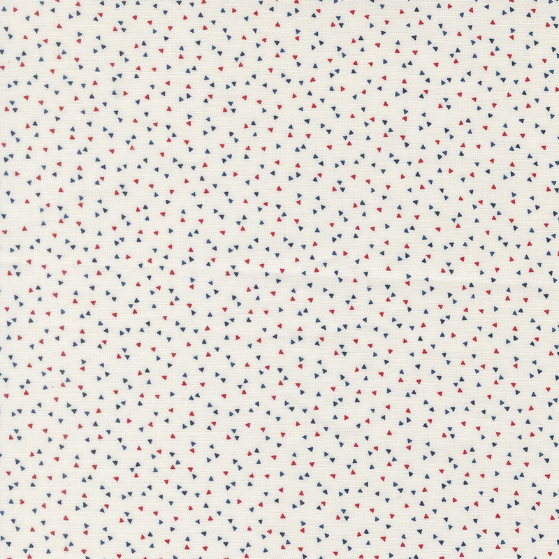 White fabric featuring a scattered pattern of small red and blue triangles.