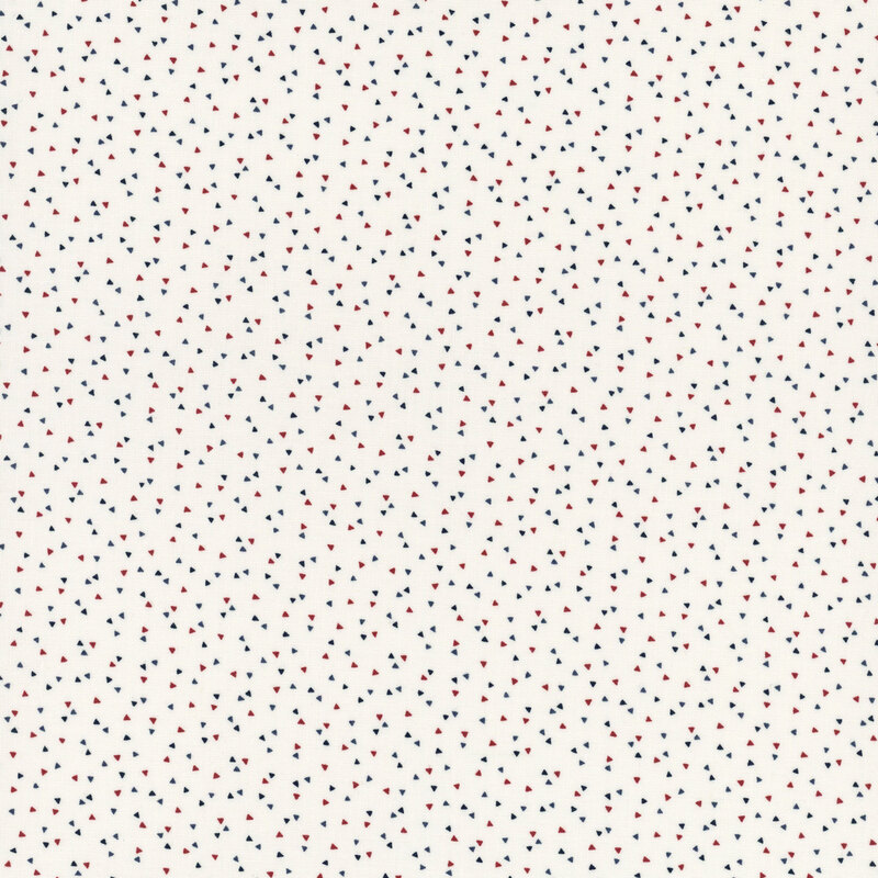 White fabric featuring a scattered pattern of small red and blue triangles.