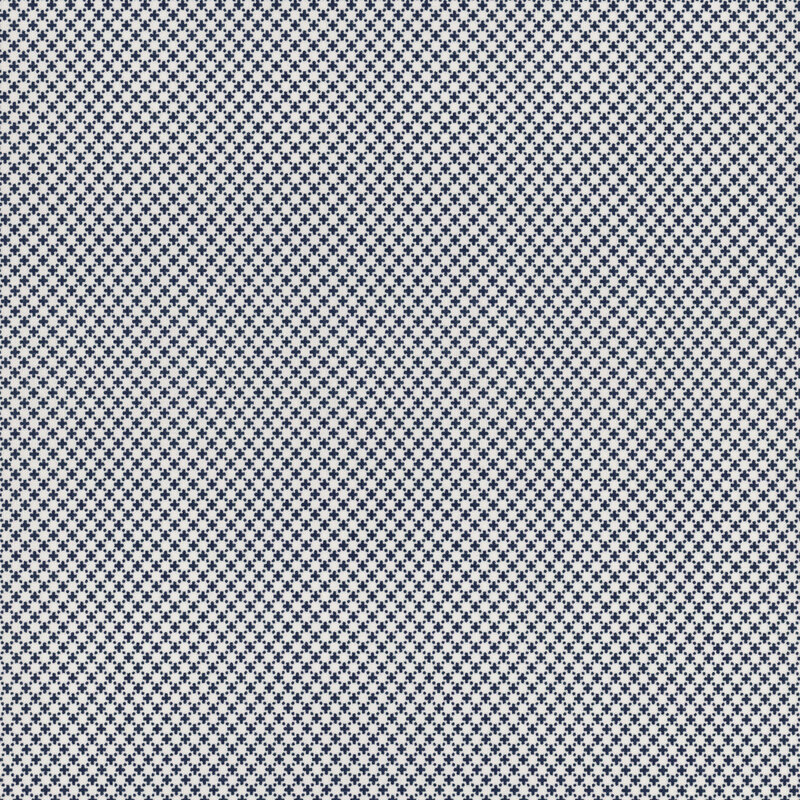 A textured fabric pattern featuring a repeating small navy blue and white cross design.