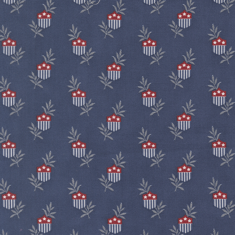 Patterned fabric featuring red and white striped cups with stars, surrounded by green leaves on a navy background.