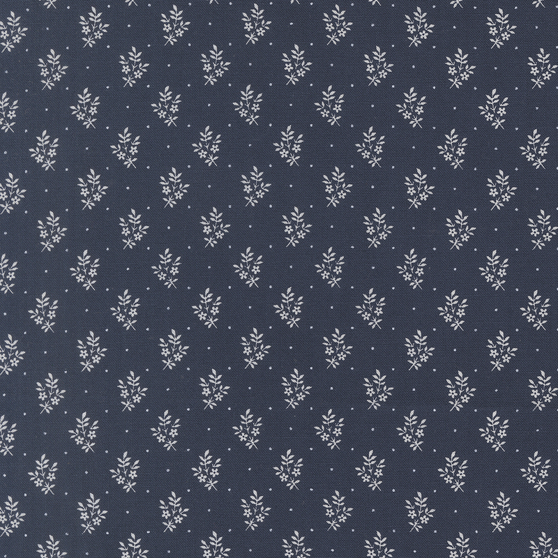 Dark blue fabric with a delicate, repeating white floral pattern throughout.