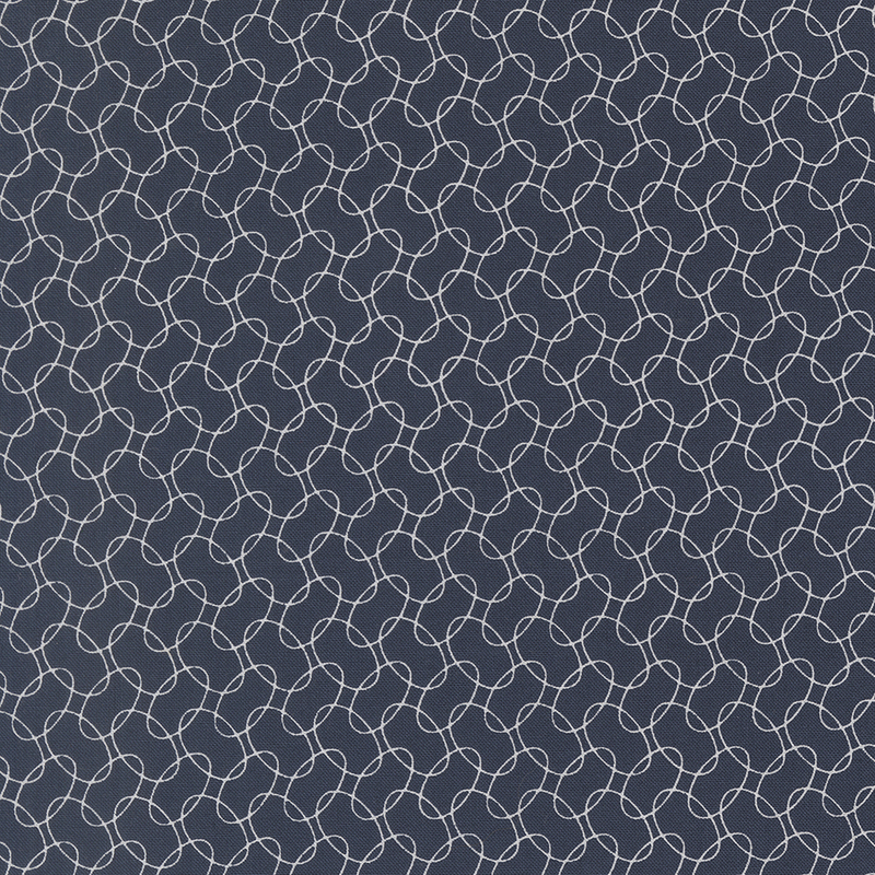 Navy blue fabric featuring a repetitive geometric pattern of interlocking white loops.