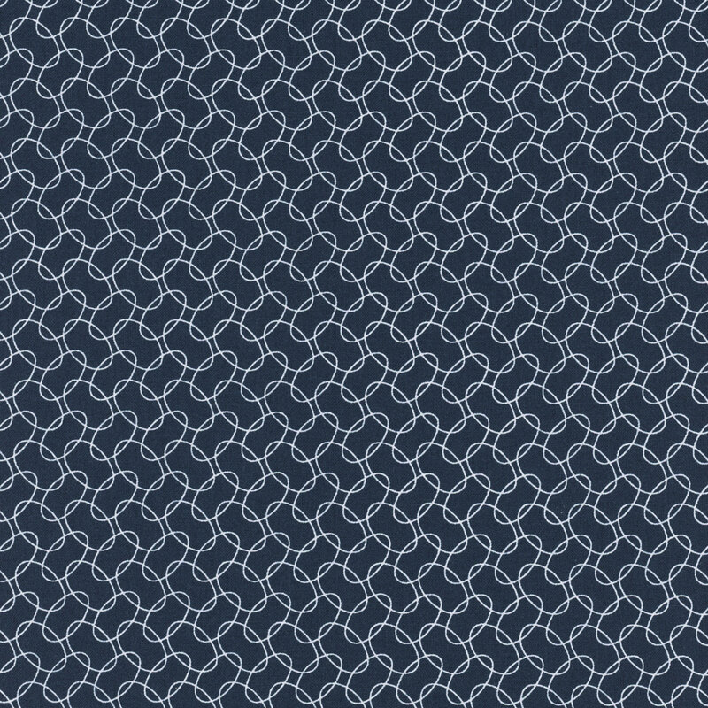 Navy blue fabric featuring a repetitive geometric pattern of interlocking white loops.