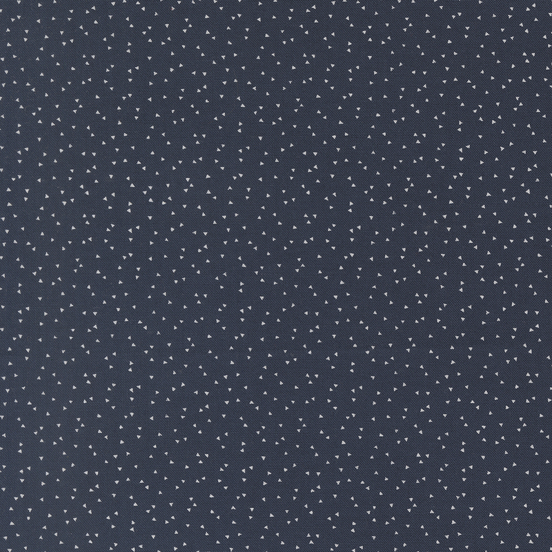 Dark navy fabric with a scattered pattern of small white triangles.