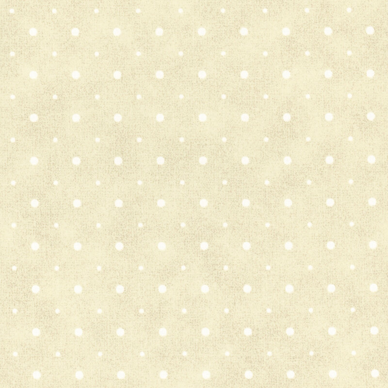 A cream fabric with small and medium sized white polka dots.