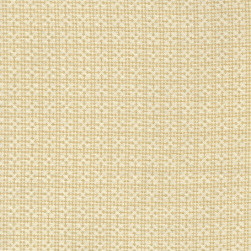 A cream fabric with a tonal ocher geometric netting design.