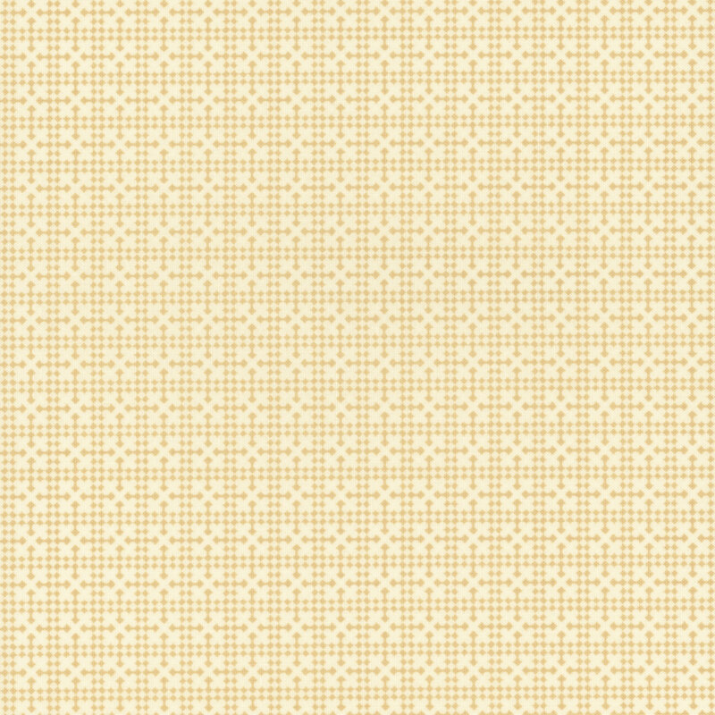 A cream fabric with a tonal ocher geometric netting design.