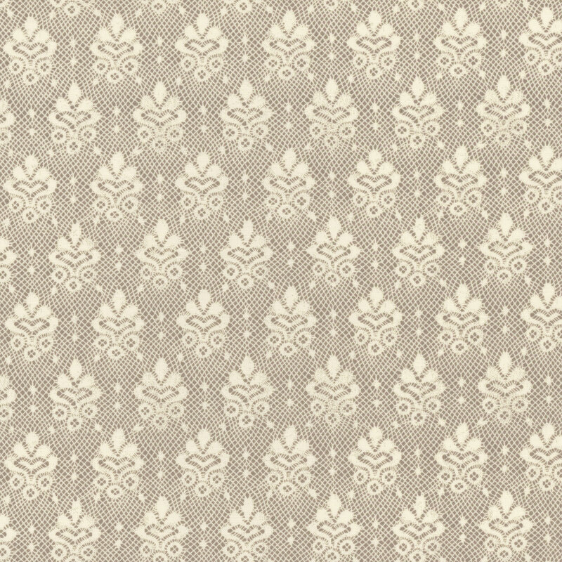 A light cream lace pattern on a light greige background.