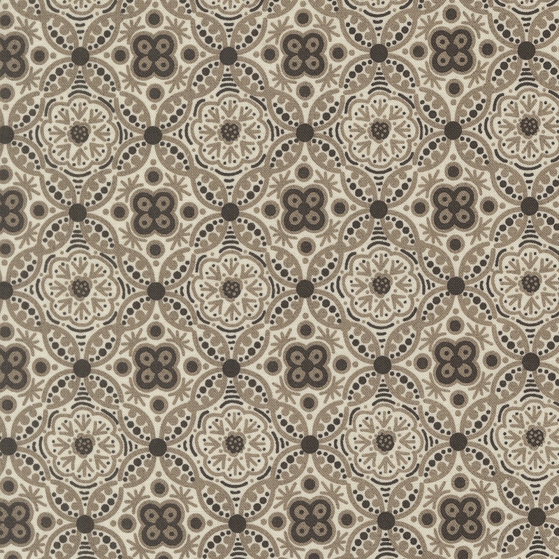 An intricate tiled and ornamental pattern in tonal cream, gray, and black.