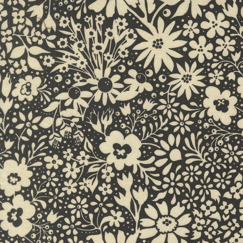 Black fabric with a dense pattern of stylized floral silhouettes in cream.