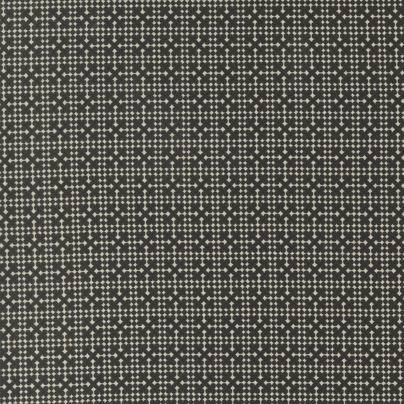 A black fabric with a cream geometric netting design.